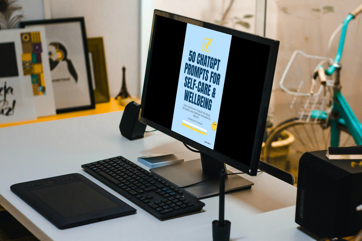 Computer monitor on a desk with a screen displaying 50_chatgpt_prompts_for_self_care_and_wellbeing, surrounded by office supplies.
