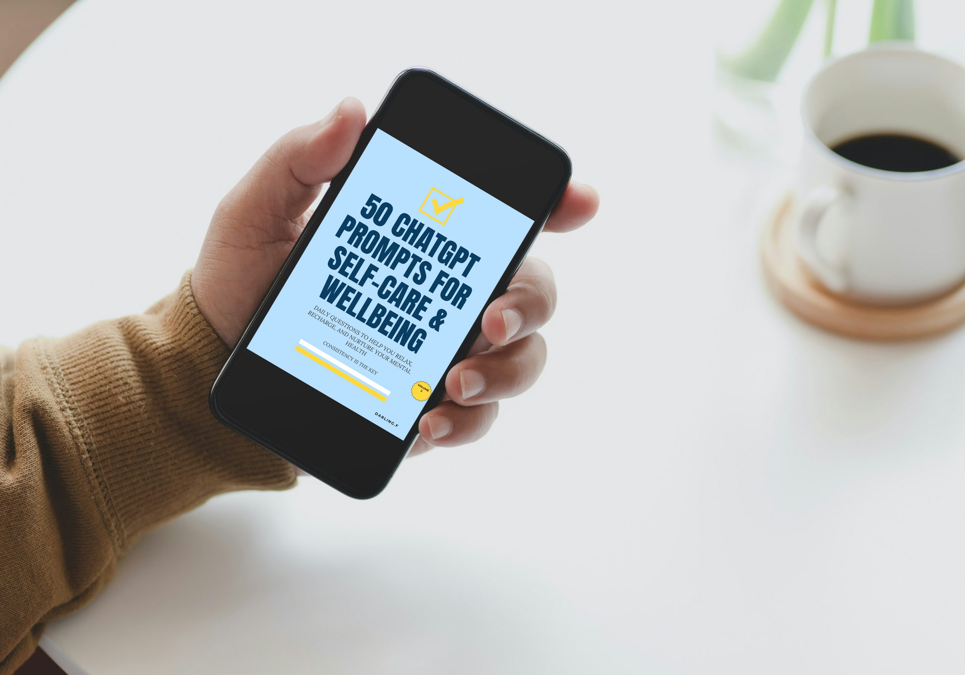 Hand holding a smartphone with a screen displaying text about ChatGPT prompts for self-care and wellbeing, with a cup of coffee in the background.